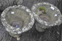A pair of stone garden urns