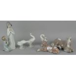 A collection of LLadro figures, including a horse, donkey and geese,