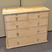 A Victorian pine chest of drawers, with two short and three long drawers,