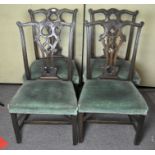 A set of four late 19th century mahogany dining chairs with upholstered seats,