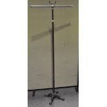 A chrome and bronzed coat stand, on four paw feet,