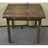 An 20th century oak draw leaf table, raised upon square and reeded legs,