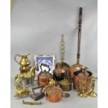 A collection of assorted brass ware, including small ship's lamps, a warming pan,