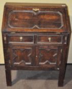 A late 19th/early 20th century stained oak bureau,