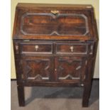 A late 19th/early 20th century stained oak bureau,