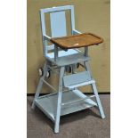 A blue painted metamorphic child's high chair,