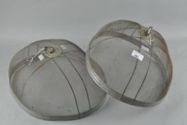A pair of wire mesh food covers,
