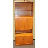 A mid century teak G-Plan drinks cabinet, in two parts,