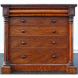 A Victorian mahogany chest of five long drawers, flanked by columns, on a plinth base,