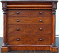 A Victorian mahogany chest of five long drawers, flanked by columns, on a plinth base,
