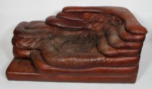 A 20th century vintage leather chaise longue, of rippled form, possibly of Danish design,