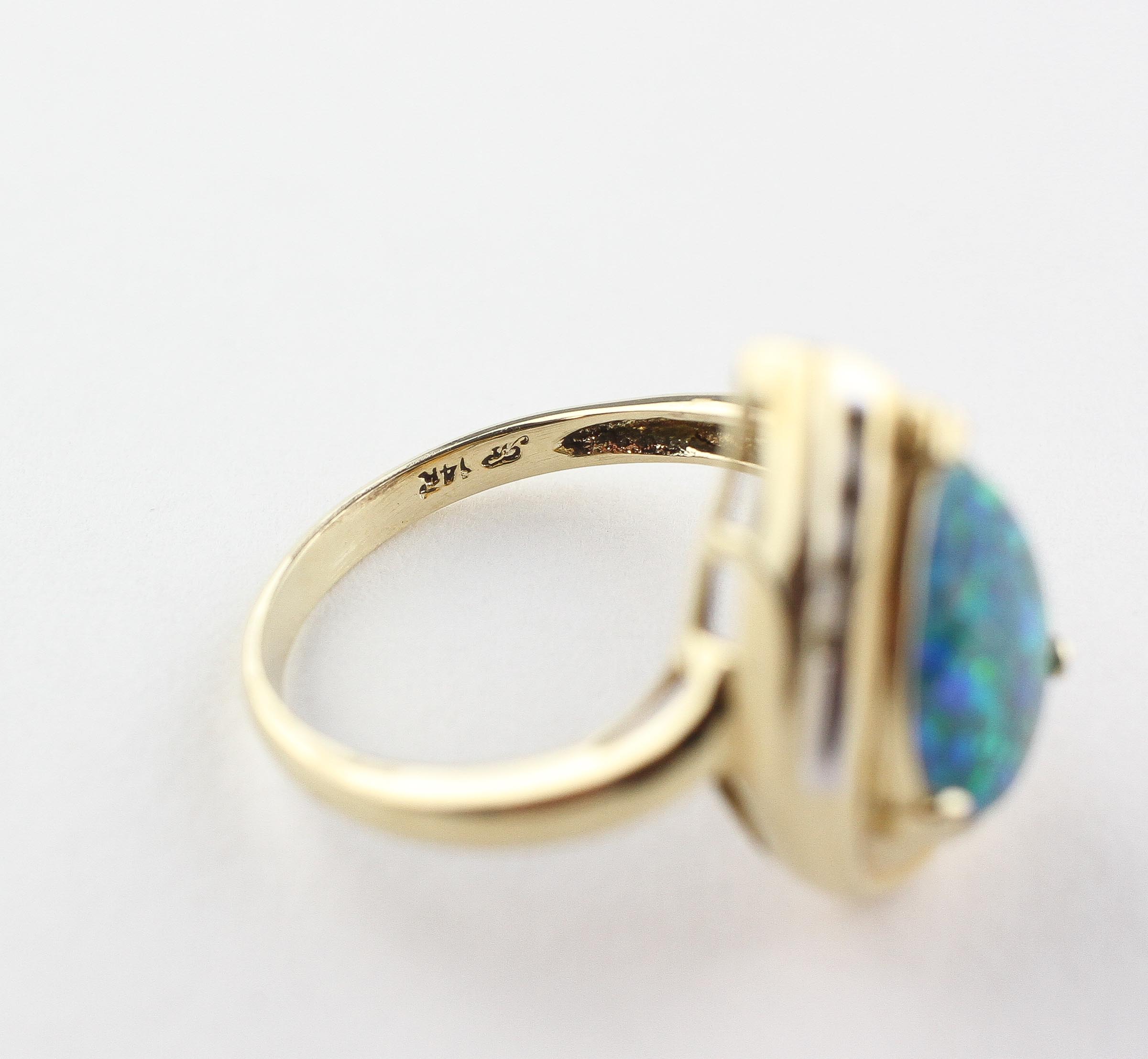 A yellow metal ring set with a synthetic mosaic opal triplet and finished with three diamonds. - Image 3 of 3