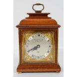 An Elliot of London mahogany cased mantel clock, with mechanical movement, in caddy top case,