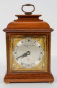 An Elliot of London mahogany cased mantel clock, with mechanical movement, in caddy top case,