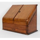 An Edwardian mahogany stationery cabinet, with a pair of doors enclosing a fitted interior,