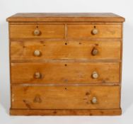 A Victorian pine chest of two short over three long drawers, with turned pulls, on a plinth base,