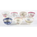 A collection of English tea bowls, mainly 18th century, porcelain and pearl ware,