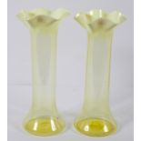 A pair of Victorian vaseline cylindrical vases, circa 1900, with opaque flared petal shaped rims,