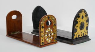 A Victorian coromandel book slide, with Gothic brass mounts and Egyptian heads,
