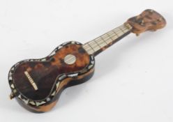 A tortoiseshell and abalone inlaid miniature guitar or mandolin, 19th century,
