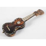 A tortoiseshell and abalone inlaid miniature guitar or mandolin, 19th century,