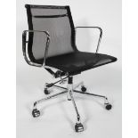 After Charles & Ray Eames, a contemporary black mesh swivel chair,