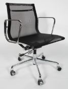 After Charles & Ray Eames, a contemporary black mesh swivel chair,