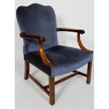 A mahogany framed Gainborough style armchair, the wavy back above scrolling arms,