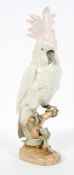 A Royal Dux Czech ceramic cockatoo, on a naturalistic base, marked to underside,