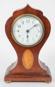 An Edwardian mahogany and inlaid mantel clock,