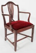 A Hepplewhite style mahogany elbow chair, with pierced splat and drop in seat,