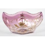 An Art Nouveau style amethyst glass dish, of lozenge form, with trailing floral decoration in gilt,