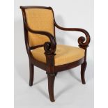 A Regency mahogany carver or elbow chair, the scrolled top rail, scrolling arms,