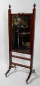 A Regency style mahogany and ebony inlaid rise and fall dressing mirror,