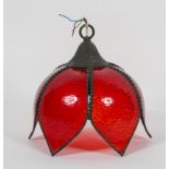 A lotus flower shaped ceiling light shade with red glass petals,