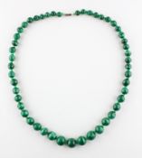 A single strand of graduated malachite beads. Forty nine irregular shaped beads