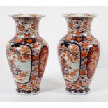 A pair of Chinese 'Imari' pattern baluster vases, 19th century, each with everted neck,