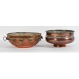 A Middle eastern hammered copper ceiling burner or lantern, 34cm diameter, and a copper footed bowl,
