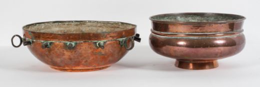 A Middle eastern hammered copper ceiling burner or lantern, 34cm diameter, and a copper footed bowl,