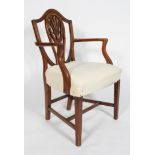 A Hepplewhite style mahogany elbow chair, with a shield shaped back,