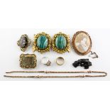 A collection of jewellery to include: Three costumer brooches; A mourning brooch;