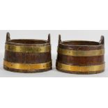 A pair of coopered oak jardinieres, of oval form, with brass bands and liner,