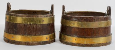 A pair of coopered oak jardinieres, of oval form, with brass bands and liner,