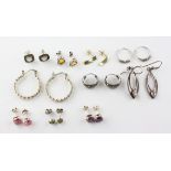 A collection of ten pairs of earrings of variable designs. Most are marked 925 for silver.