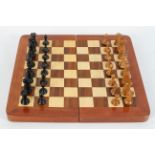 A Jacques Staunton style weighted part chess set, boxwood and ebonised, some stamped with a crown,