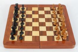 A Jacques Staunton style weighted part chess set, boxwood and ebonised, some stamped with a crown,