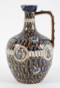 A Doulton Lambeth stoneware ewer, late 19th century, with scale or pine cone decoration,