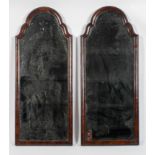 A pair of Queen Anne style walnut framed mirrors, of arched form, the glass with a star motif,