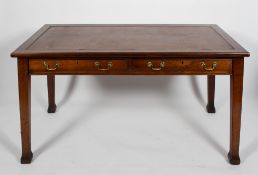 A Victorian mahogany writing table, with leather inset,