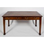 A Victorian mahogany writing table, with leather inset,